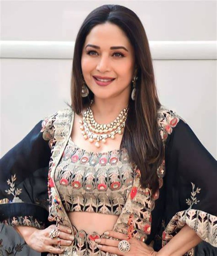 Madhuri Dixit begins the mahurat shot of her next film with her husband